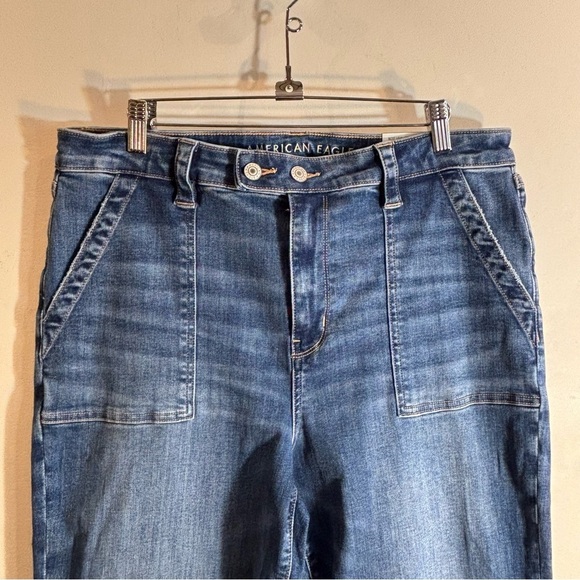 AMERICAN EAGLE Sz 16S Super High Rise Flare Distressed Hem Mid-Wash Jeans NEW - Picture 2 of 13